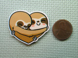 Second view of the A Pair of Heart Hugging Sloths Needle Minder