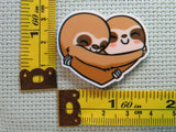 Third view of the A Pair of Heart Hugging Sloths Needle Minder