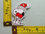 Third view of the Heart Hugging Snoopy with a Red Cap Needle Minder