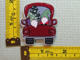 Third view of the A Couple of Gnomes in the Back of a Red Truck with a Tree Needle Minder
