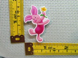 Third view of the Dancing Piglet Needle Minder