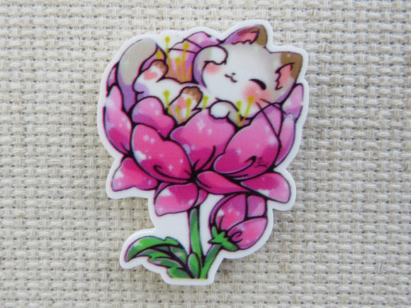 First view of Sleepy Kitty in a Pink Flower Needle Minder.