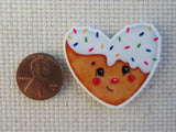 Second view of heart frosted cookie needle minder.