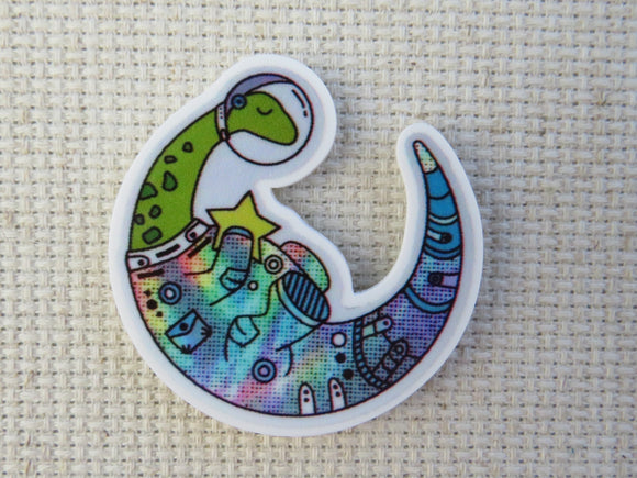 First view of Space Dinosaur Holding a Star Needle Minder.