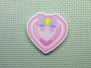 First view of the Pink Jeweled Looking Heart Needle Minder