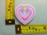 Third view of the Pink Jeweled Looking Heart Needle Minder