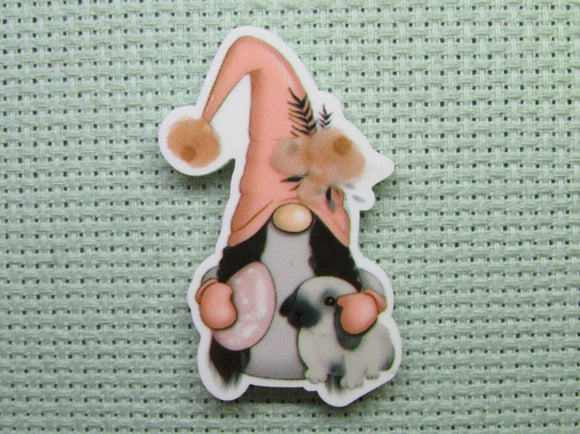 First view of the Easter Gnome Holding a Bunny and an Egg Needle Minder