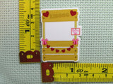 Third view of the Kissing Booth Needle Minder