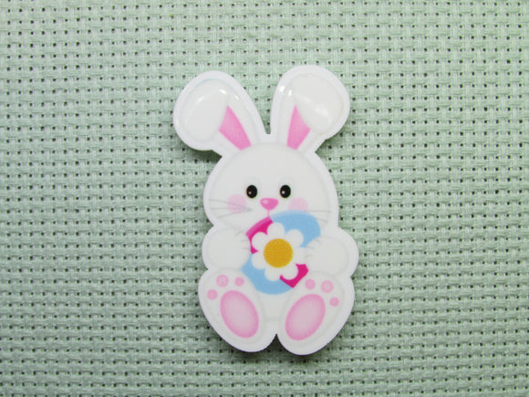 First view of the Easter Bunny Holding a Pretty Flower Easter Egg Needle Minder