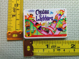 Third view of the Vintage Game Chutes and Ladders Needle Minder