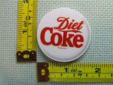 Third view of the Diet Coke Needle Minder