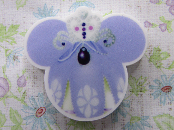First view of the Small Purple and White Mouse Head with a Crown Needle Minder