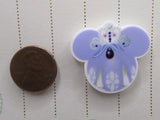 Second view of the Small Purple and White Mouse Head with a Crown Needle Minder