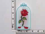 Fourth view of rose under a glass dome needle minder.