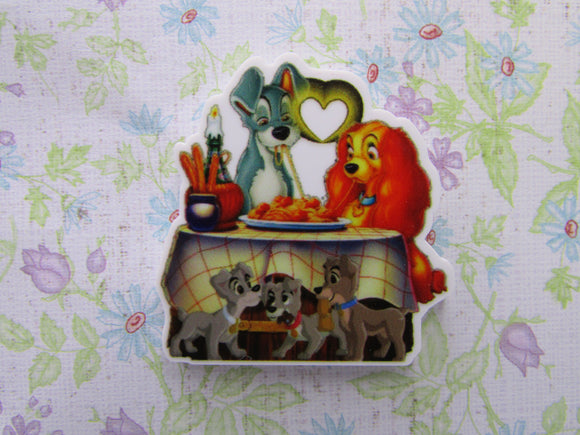 First view of the Lady and the Tramp Eating Spaghetti with Pups Playing Under the Table Needle Minder