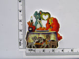 Fourth view of the Lady and the Tramp Eating Spaghetti with Pups Playing Under the Table Needle Minder