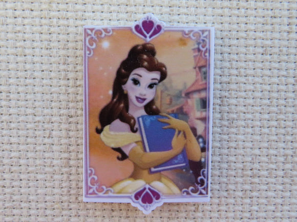 First view of Belle Holding a Book Needle Minder.