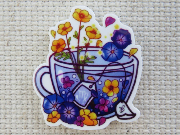 First view of Beautiful Blue Floral Teacup Needle Minder.