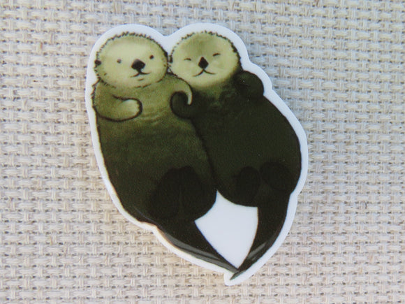 First view of A Pair of Floating Otters Needle Minder.