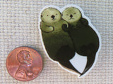 Second view of A Pair of Floating Otters Needle Minder.