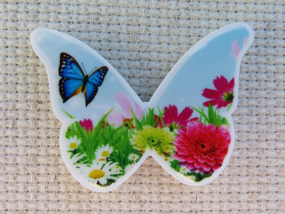 First view of Blue Butterfly Fluttering Over Daisies Needle Minder.