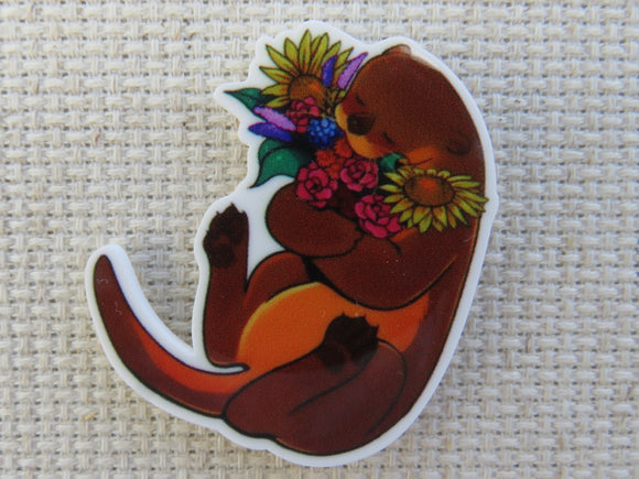 First view of Otter Hugging Flowers Needle Minder.