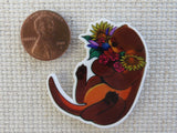 Second view of Otter Hugging Flowers Needle Minder.