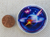 Second view of Stunning Saturn Needle Minder.