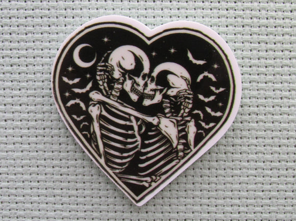 First view of the A Pair of Skeletons In a Heart Needle Minder