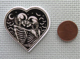 Second view of the A Pair of Skeletons In a Heart Needle Minder