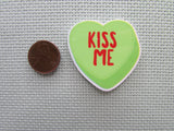 Second view of the Kiss Me Conversation Heart Needle Minder