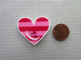 Second view of the Cheshire Cat Grinning Heart Needle Minder