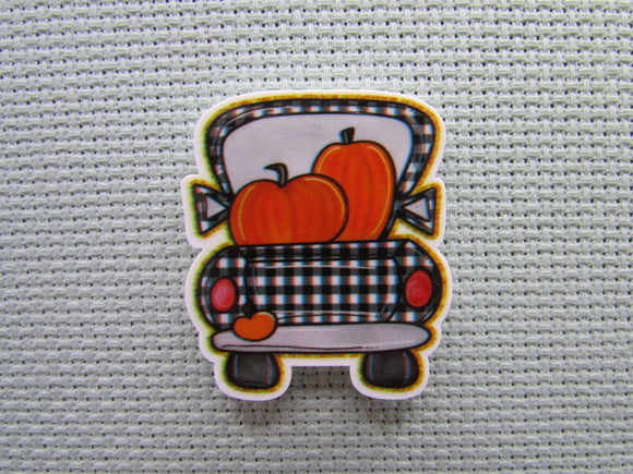 First view of the Black and White Checkered Pumpkin Truck Needle Minder