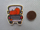 Second view of the Black and White Checkered Pumpkin Truck Needle Minder