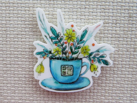 First view of Blue Teacup with Yellow Flowers Needle Minder.