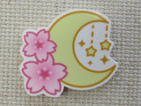 First view of Pink Hibiscus Flowers Adorn a Moon with Dangling Stars Needle Minder.