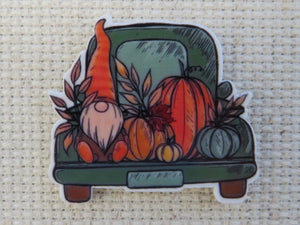 First view of gnome in the back of a green truck needle minder.