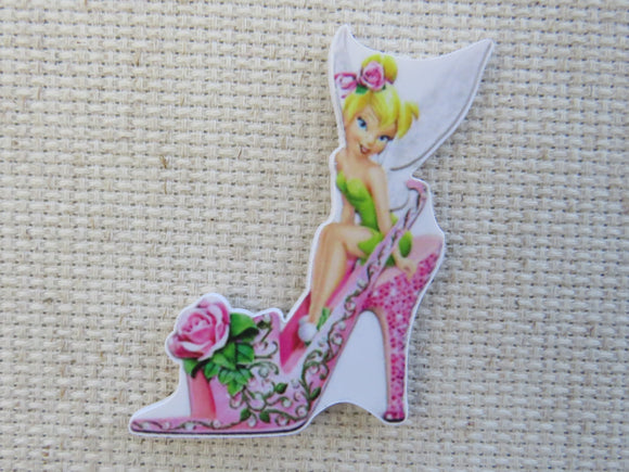 First view of Tinker Belle Sitting Atop of Pretty Pink Shoe Needle Minder.