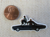 Second view of A Couple of Winchester Boys Sitting on a Black Car Needle Minder.