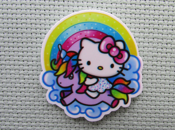 First view of the Cute White Kitty Riding a Purple Unicorn Under a Rainbow Needle Minder