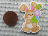 Second view of the Tan Easter Bunny with a Stack of Colorful Eggs Needle Minder