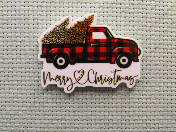 First view of the Merry Christmas Buffalo Plaid Christmas Tree Carrying Truck Needle Minder