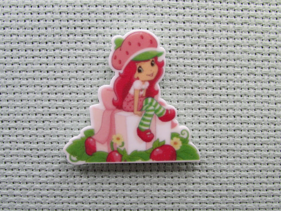 First view of the Strawberry Shortcake Sitting on a Gift Needle Minder