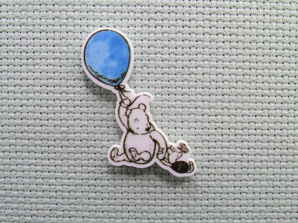 First view of the Small Black and White Pooh and Piglet Flying Away on a Blue Balloon Needle Minder