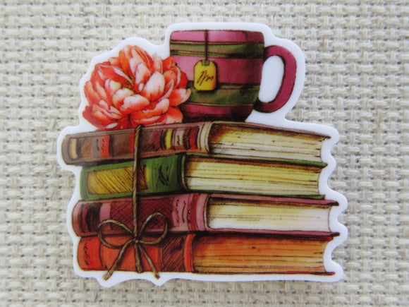First view of Autumn Colored Stack of Books with a Mug on Top Needle Minder.