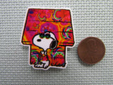 Second view of the Tie Dye Snoopy House Needle Minder