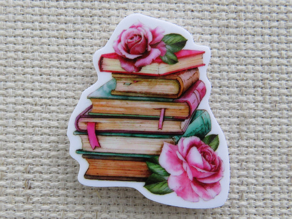 First view of A Pile of Six Books with Pink Roses Needle Minder.