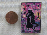Second view of Rapunzel with a Purple Background Needle Minder.