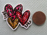 Second view of the Love XOXO Hearts Needle Minder