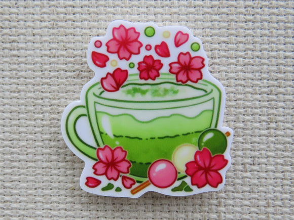 First view of Green Tea Cup with Pink Flowers Needle Minder.